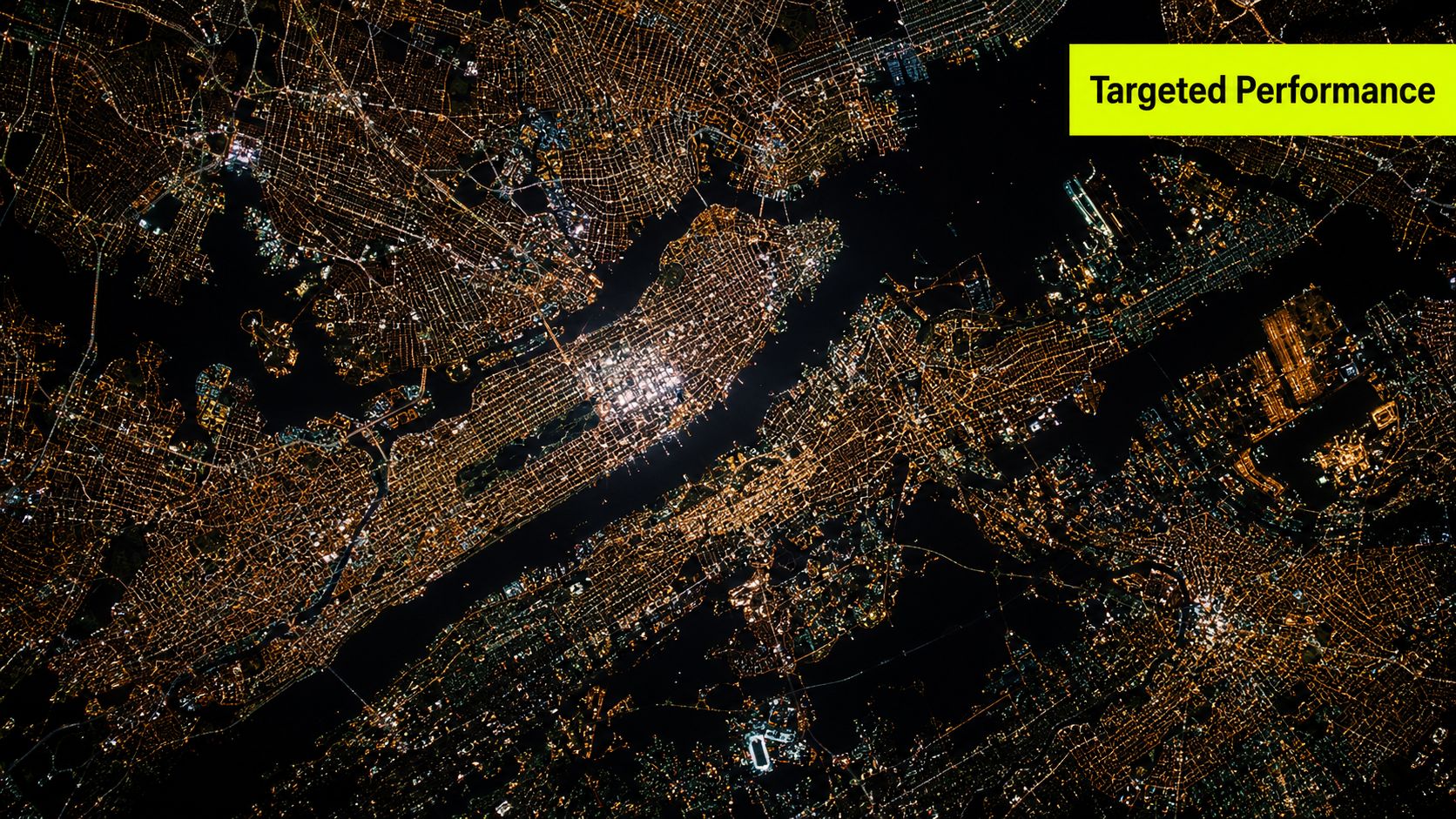 A high-angle nighttime satellite view of a brightly lit sprawling metropolitan city with complex road networks.